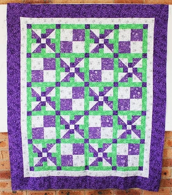 snuggle-blossom-purple-crib-quilt,quilting,craft,sewing